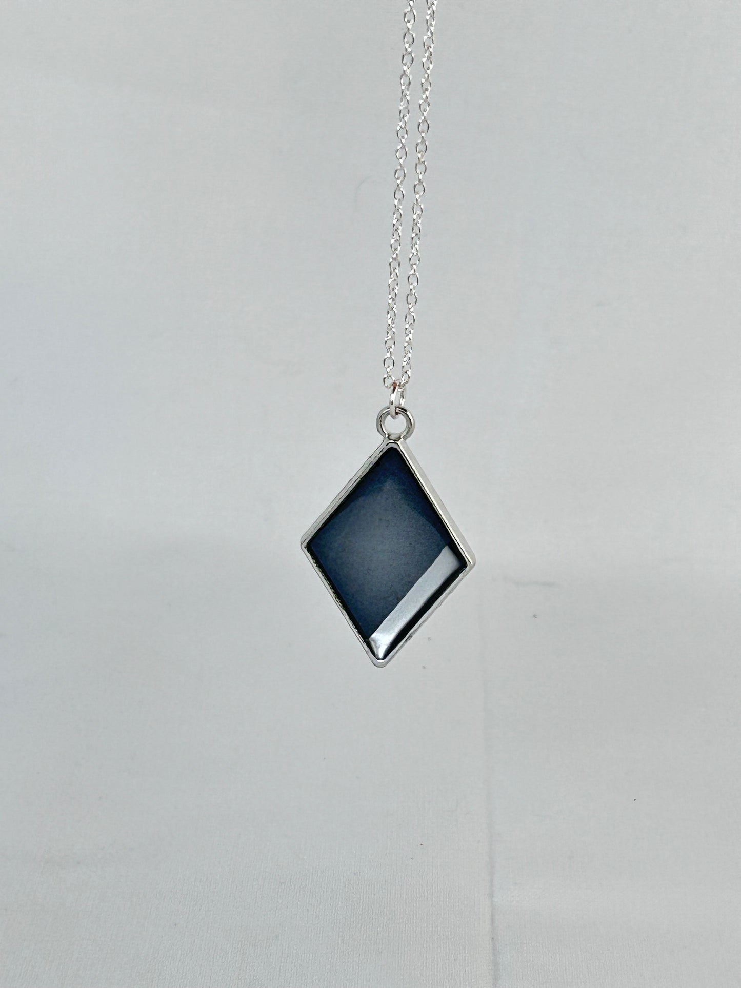 Smokey Black and Silver diamond shaped pendant necklace. Hand painted