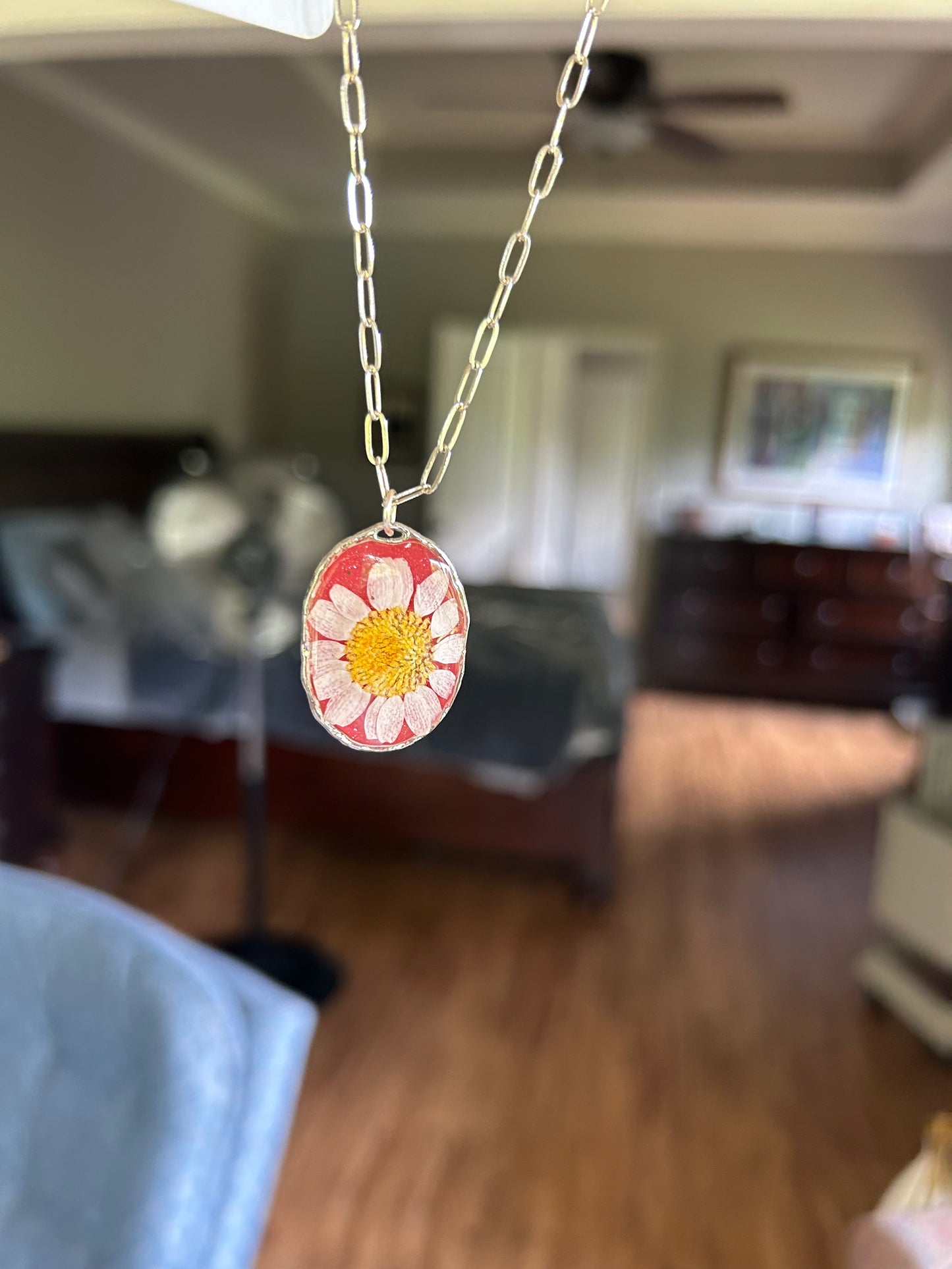 A White Daisy preserved dried flower with a Watermelon Red tinted background Pendant Necklace, Silver round framed bezel, Silver Paperclip chain