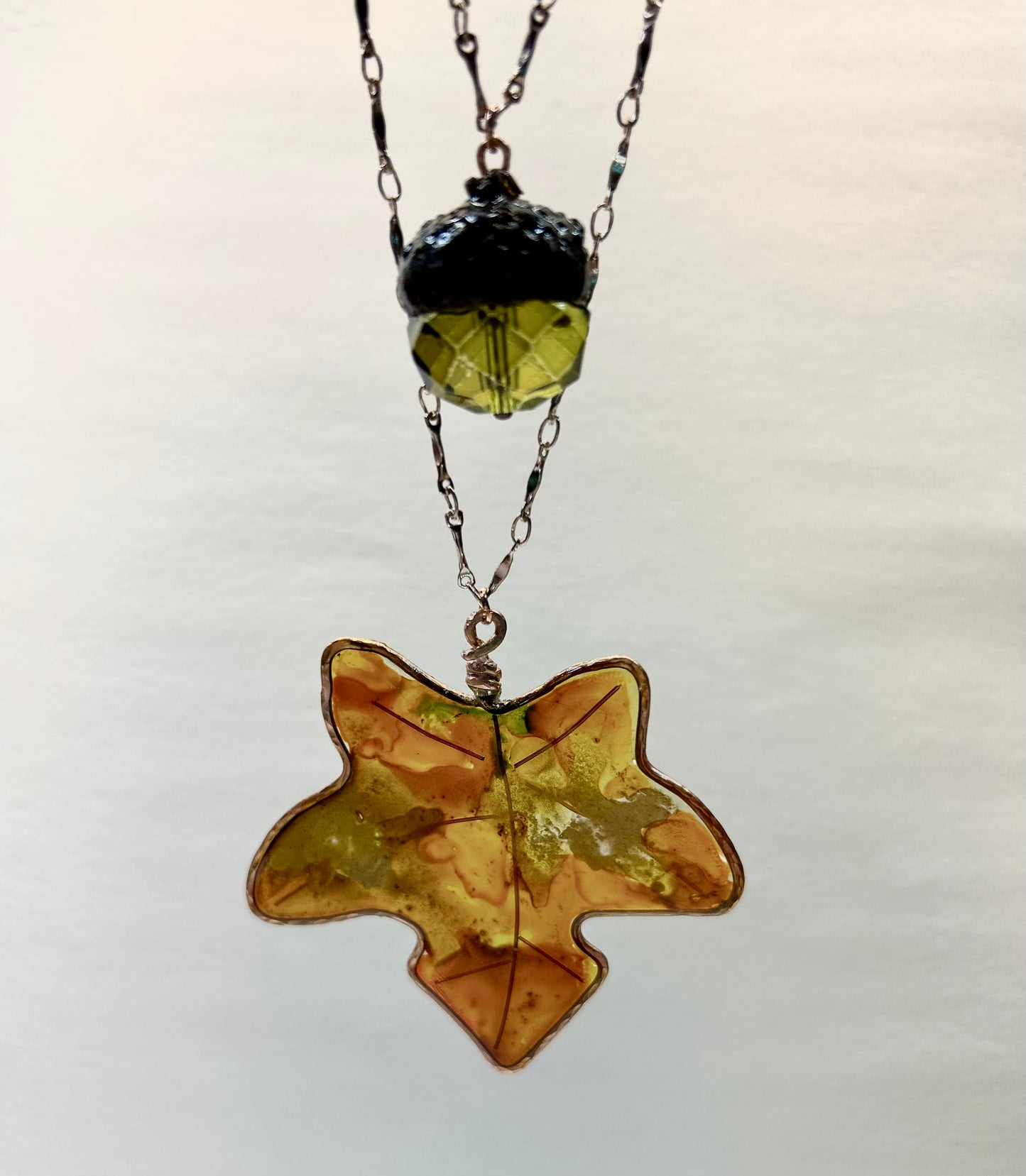 Fall Maple Leaf, Resin Pendant Hand painted with Alcohol Ink encased in hammered Copper, accented with Green Bead Acorn, 25” Double Chain Rose Gold Tone Chain