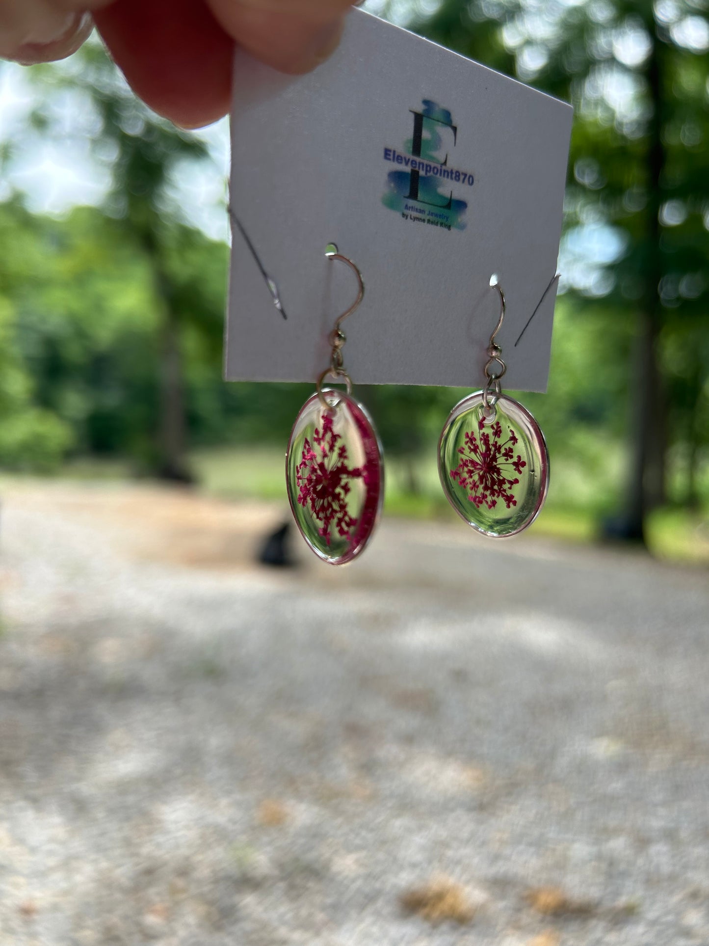 Silver tone earrings with queen and lace flower, Round, Clear Resin Dangles