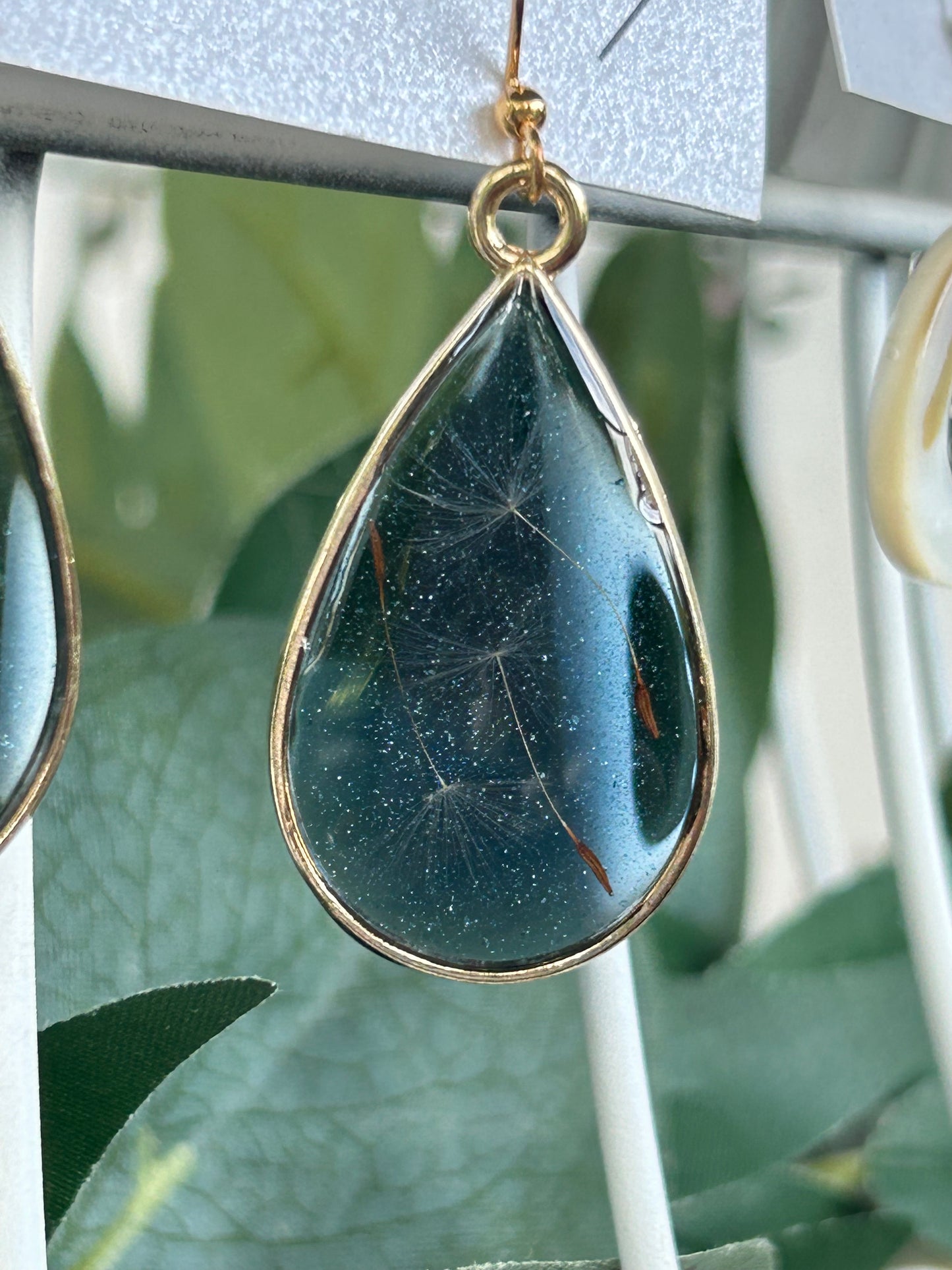 Make A Wish” Dandelion Seed Teardrop Dangle Earrings with a Blue Shimmery Background, Gold Frames