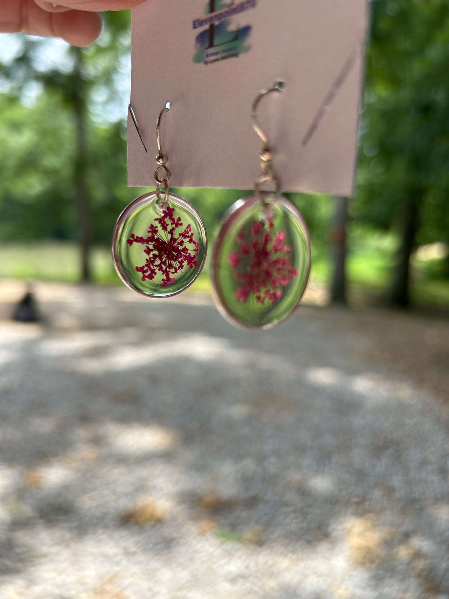 Silver tone earrings with queen and lace flower, Round, Clear Resin Dangles