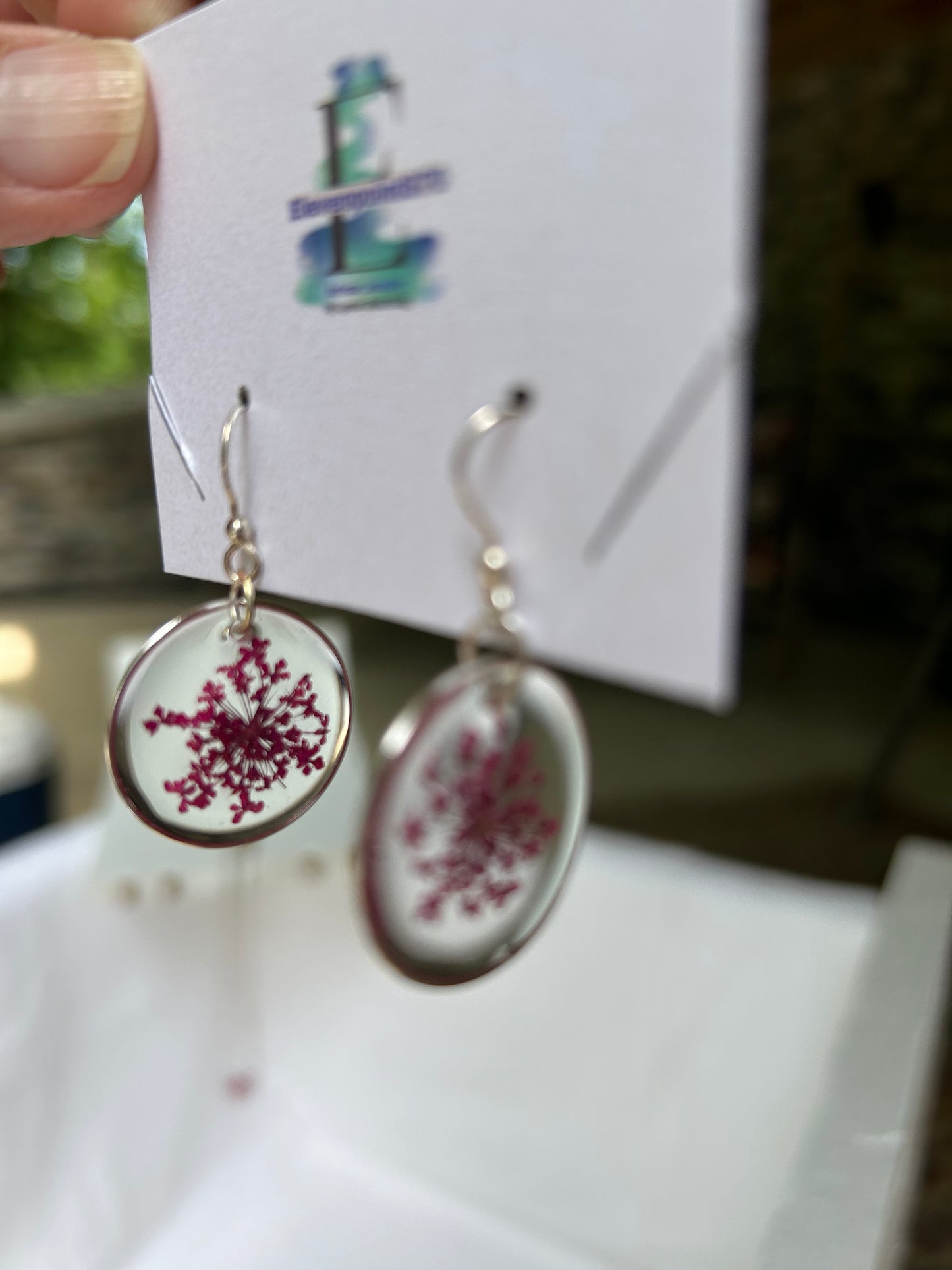 Silver tone earrings with queen and lace flower, Round, Clear Resin Dangles